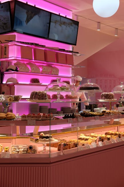 Pink themed bakery interior with pastries on display