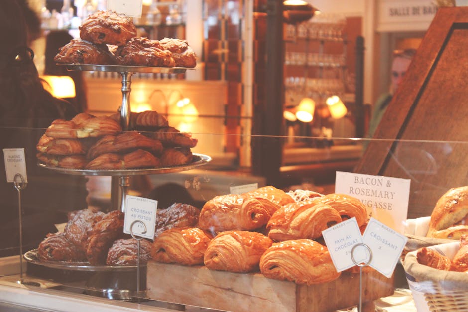 Assorted croissants and pastries in a bakery display
